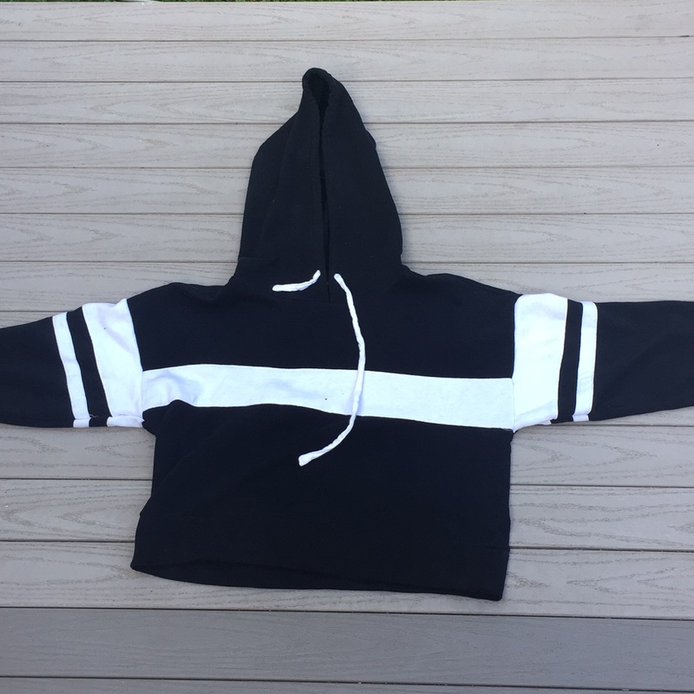 Black with white stripes, hooded crop top.